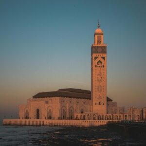 Stunning view of Hassan II Mosque against the sunset sky in Casablanca, Morocco.