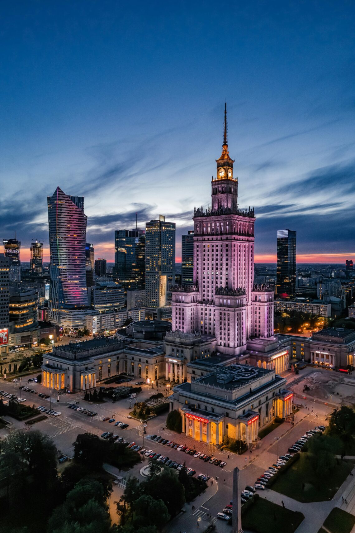Majestic view of Warsaw's skyline featuring the Palace of Culture and Science at dusk.