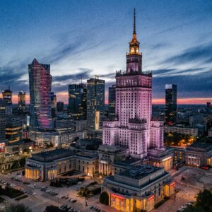 Majestic view of Warsaw's skyline featuring the Palace of Culture and Science at dusk.