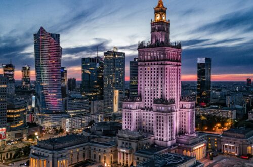 Majestic view of Warsaw's skyline featuring the Palace of Culture and Science at dusk.