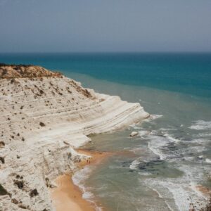 Breathtaking aerial view of Scala dei Turchi with white cliffs and turquoise sea in Sicily.