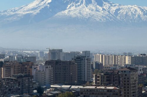 Scenic panorama of Yerevan city with Mount Ararat in the background, showcasing urban landscape under a clear sky.