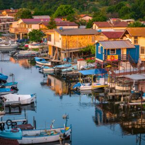 Tranquil morning view of a traditional coastal village with boats in Burgas, Bulgaria.