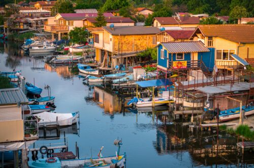 Tranquil morning view of a traditional coastal village with boats in Burgas, Bulgaria.