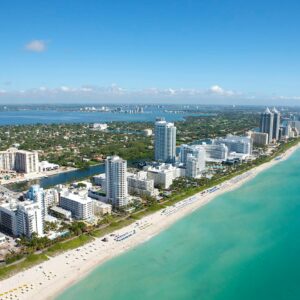 Stunning aerial view of Miami Beach's skyline along the Atlantic Ocean, ideal for travel and adventure imagery.