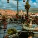 Enjoy a stunning view from a traditional Moroccan terrace overlooking Marrakesh under a vibrant sky.
