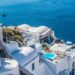 Whitewashed Santorini architecture overlooking the deep blue Aegean Sea.