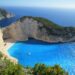 A breathtaking view of Navagio Beach with azure waters surrounded by cliffs in Greece.