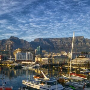Stunning view of Cape Town harbor with boats and iconic Table Mountain backdrop.
