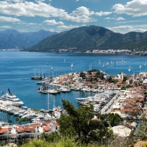 Breathtaking view of Marmaris harbor with yachts and sailboats under a clear sky.